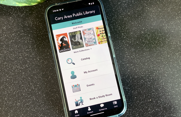 A smartphone with the CAPL mobile app home screen on display.