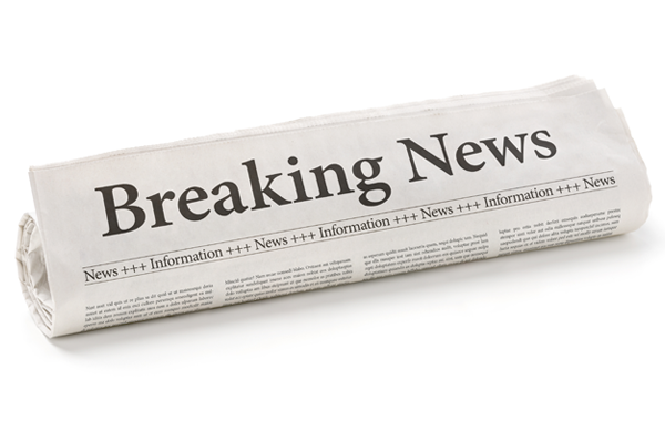 Folded newspaper with a headline that says "Breaking News."